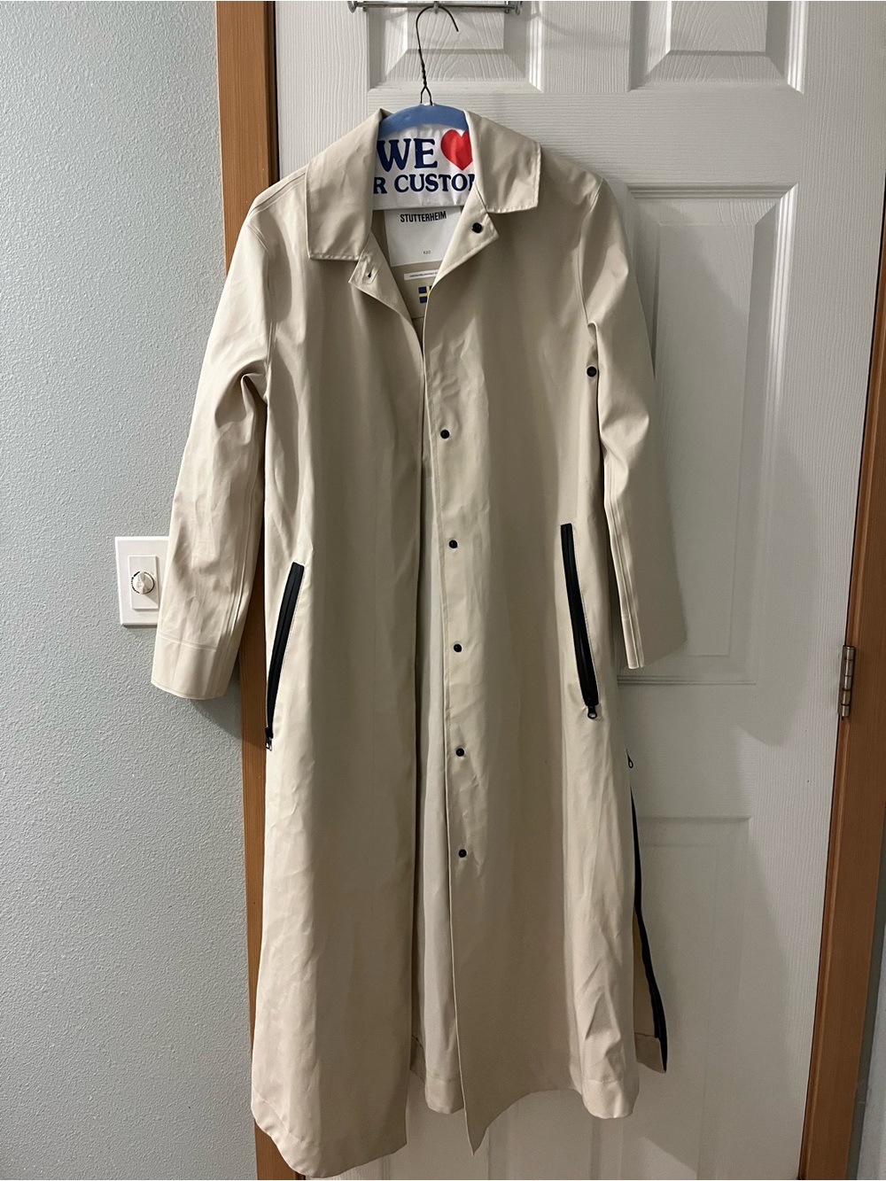 Stutterheim Off-White Long Trench Coat with Black Zipper Accents
